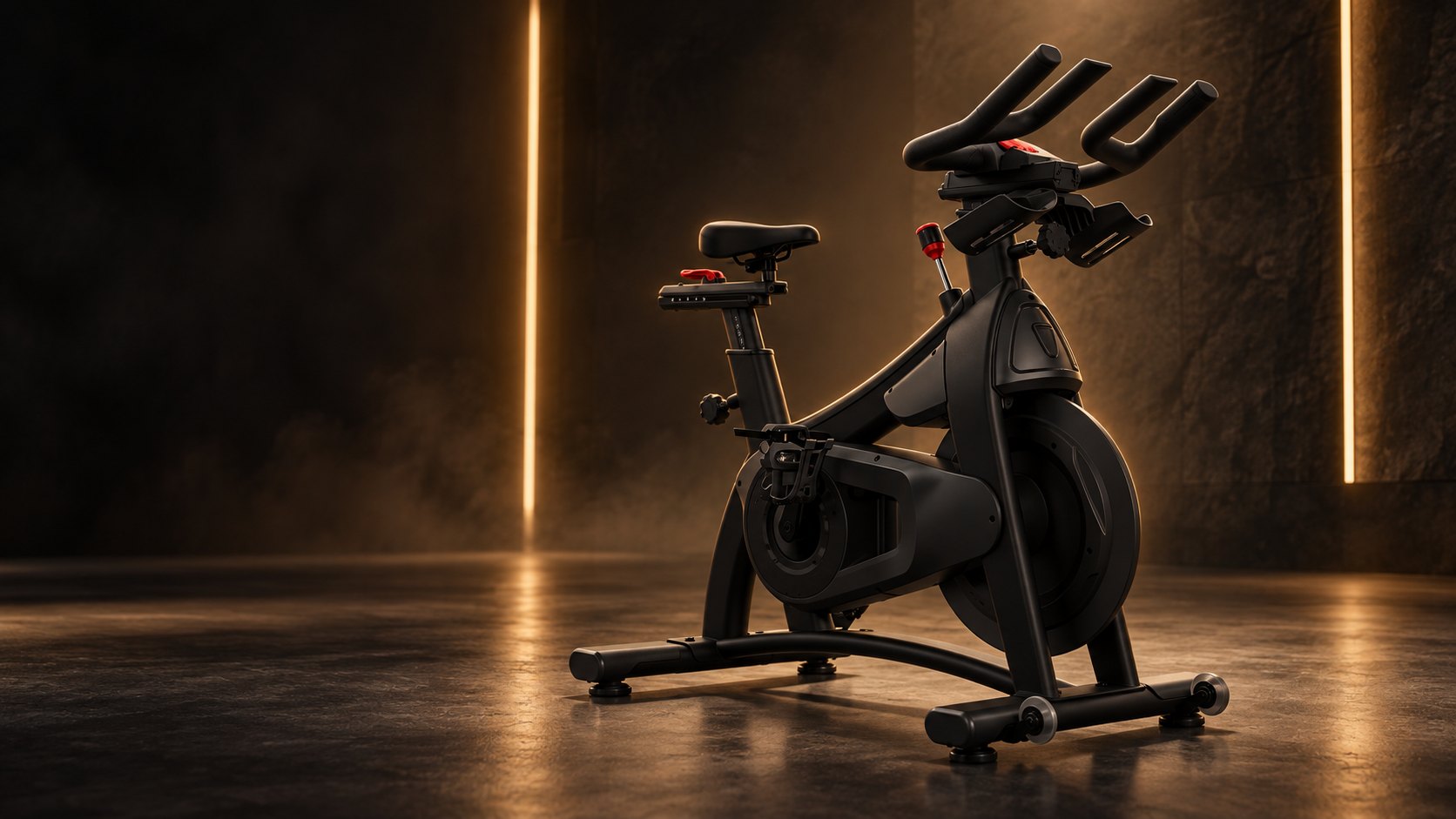 A matte black Cycle House studio bike on a dark stone floor, lit by warm gold light strips against a rough rock wall